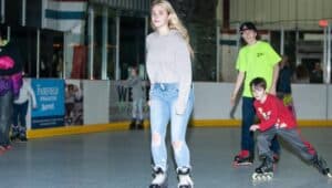 Boys and girls roller skating at the Marple Sports Arena.