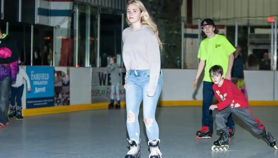 Boys and girls roller skating at the Marple Sports Arena.