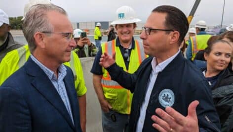Eddystone-based Aero Aggregates of North America CEO Archie Filshill with Gov. Josh Shapiro on site Friday when Interstate 95 was reopened