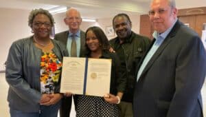 Holding the exoneration proclamation for Alexander McClay William are (from left) his niece, Osceola Williams; family attorney Robert Keller, Osceola and Kenny Perdue and Dr. Sam Lemon.