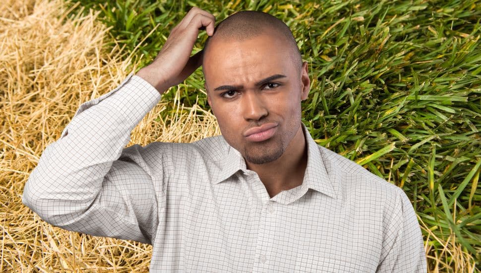 Man scratching his head