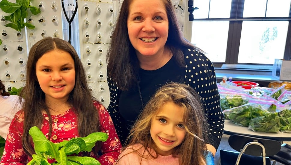 Third grader Aubree Everitt, teacher Dr. Jennifer Chrisman, and kindergartener Makenna Stewart.