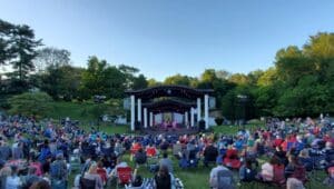Visitors enjoy a summer concert at the Rose Tree Park amphitheater.