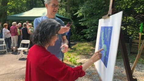 Brian and Lucia Larson study the map of the Saul and Chadwick wildlife preserves.