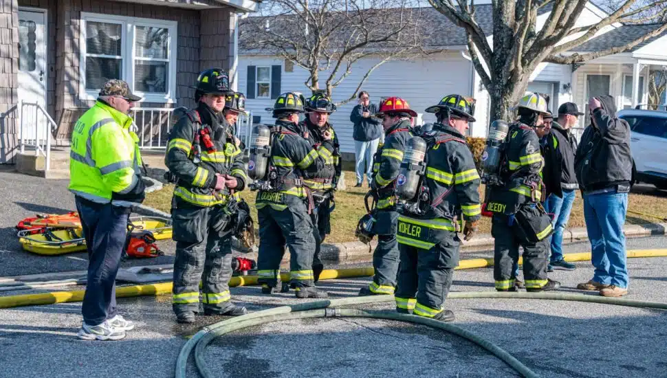 Volunteer firefighters at a fire scene.