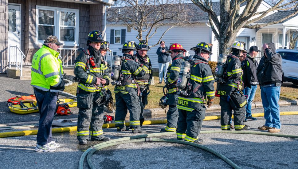 Volunteer firefighters at a fire scene.