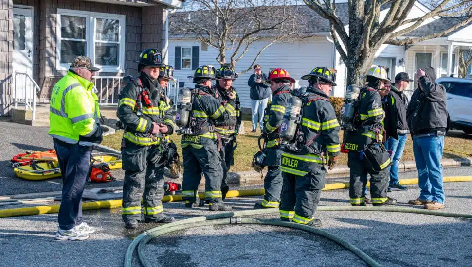 Volunteer firefighters at a fire scene.