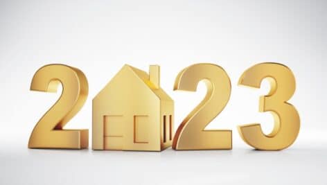 A golden 2023 sign with a house replacing the zero.