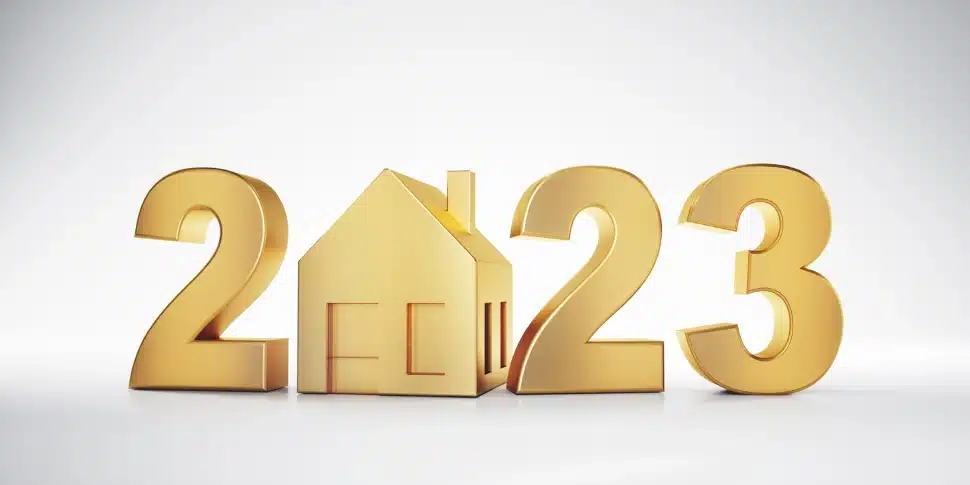 A golden 2023 sign with a house replacing the zero.