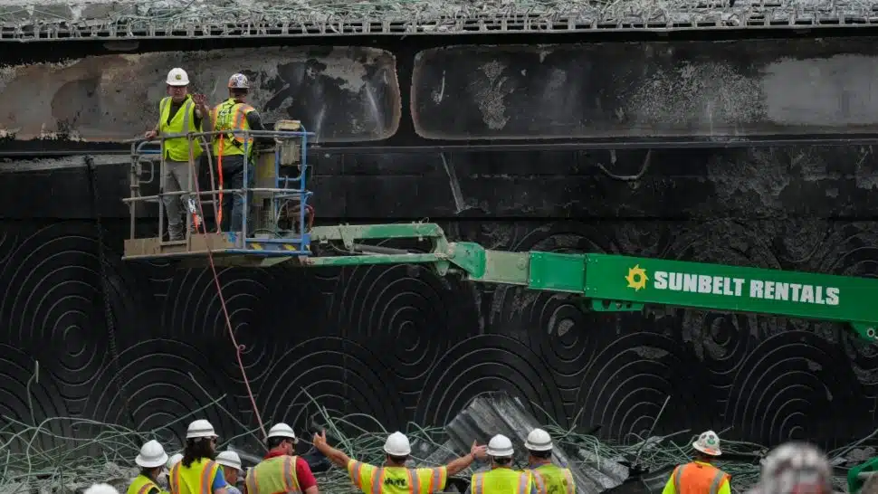 Work crews at the site of the I-95 overpass collapse.