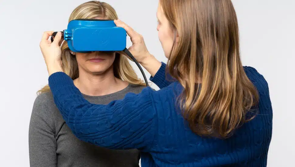 Helena Esmonde uses the goggles as she works with a patient.