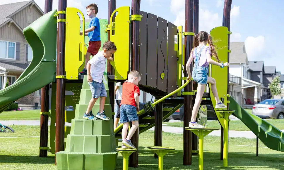 Boys and girls playing on playground equipment