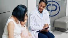 A family visits with a pediatrician