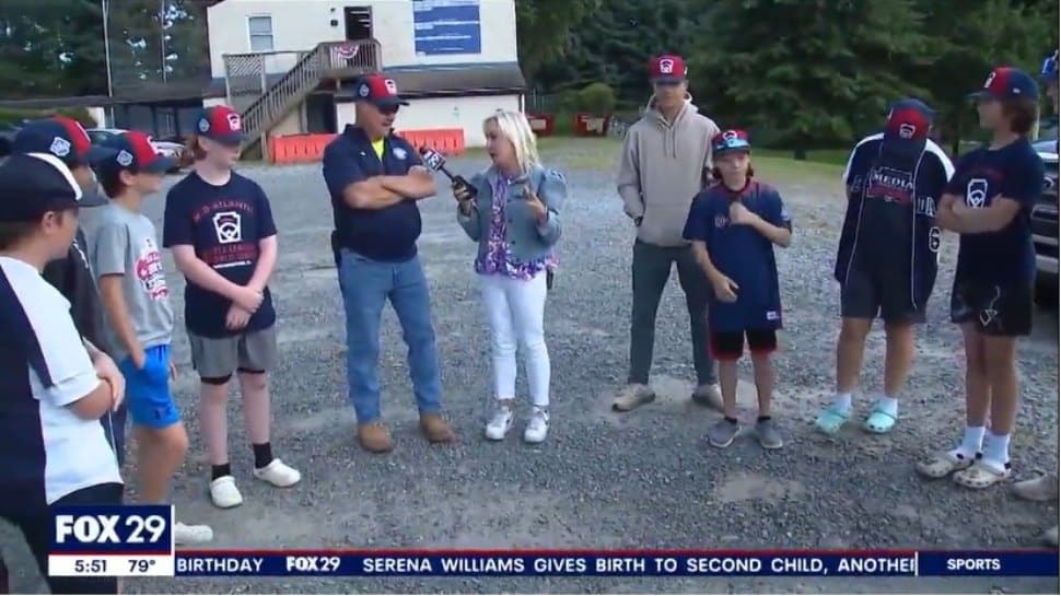 The boys of the Media Little League team with manager Tom Bradley being interviewed by Fox 29.