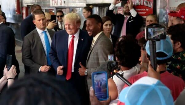 Former President Donald Trump poses with Darwin Cooper of Vineland, N.J., during a visit to Pat’s King of Steaks in Philadelphia in June.