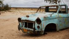 Old rusty car on a beach