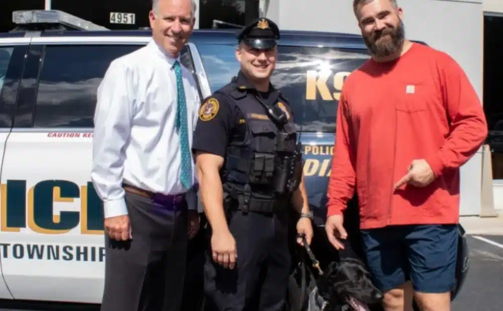 The Haverford Police Department's newest K-9 Officer Winnie, with her handler Officer Anthony Patterson, car dealer Steve Videon, left, and the Philadelphia Eagles' Jason Kelce.