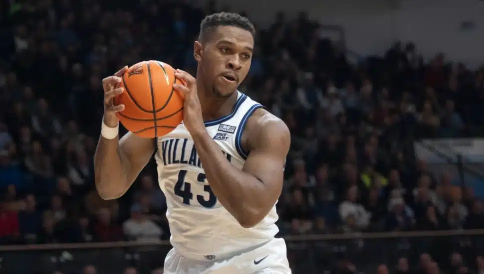 Villanova Wildcat Eric Dixon in possession of the ball on the court during a game.
