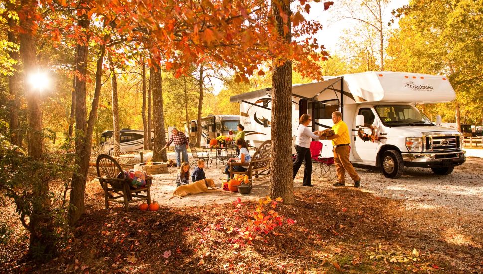 People out camping in the woods at a campground.