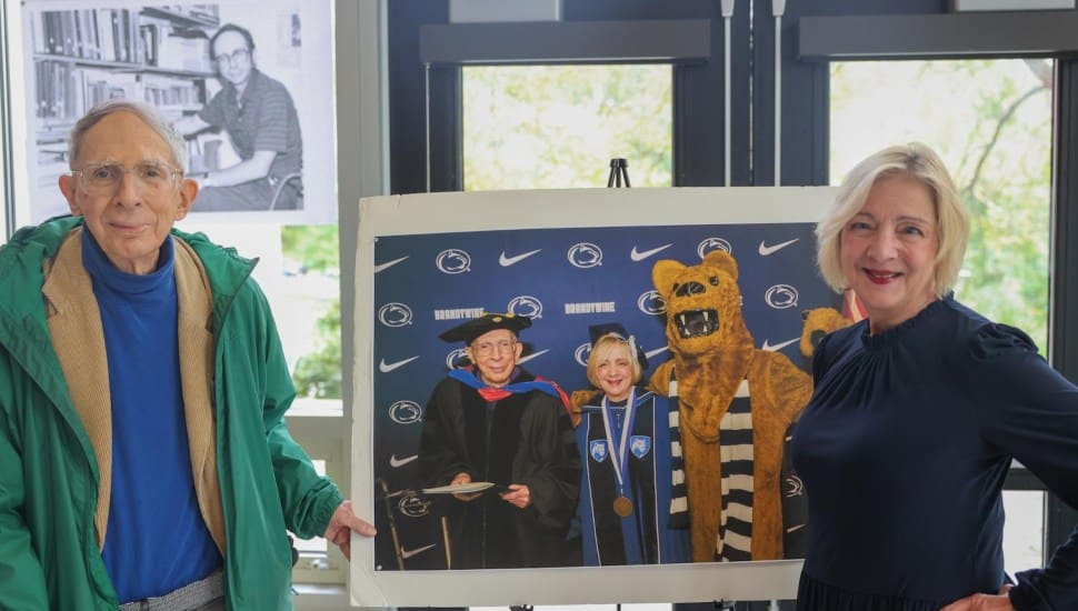 Stephen Cimbala, left, distinguished professor of political science, recently celebrated a career milestone when he completed his 50th year of service at Penn State Brandywine. Chancellor Marilyn J. Wells, right, and members of the Brandywine community gathered to celebrate this milestone.