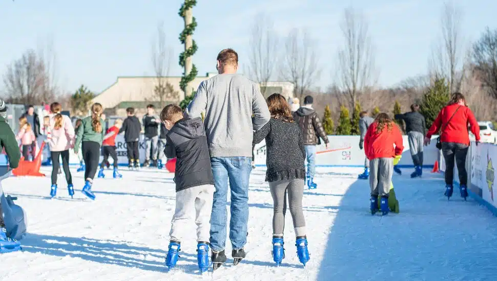 A crowd skates on the Flight on Ice skating rink in Newtown Square.