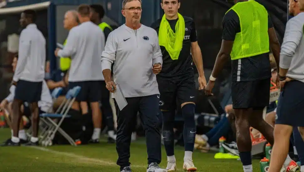 : Penn State men's soccer coach Jeff Cook, center.