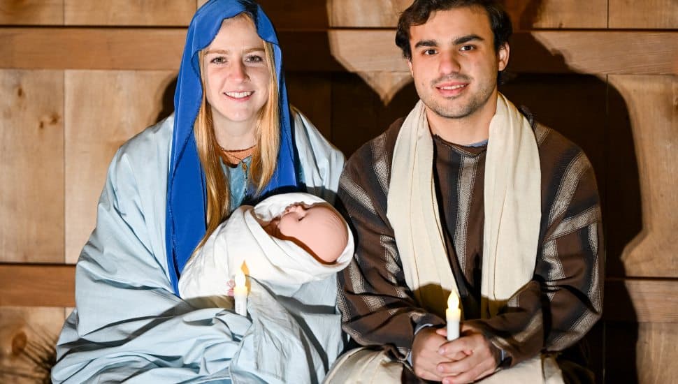 A re-enactment of the Christmas story at Neumann University with a portrayal of Mary, Joseph and the baby Jesus in the manger.