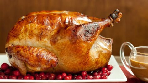 A roasted turkey with cranberries.