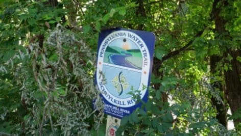 A Schuylkill River Greenways sign in Reading along the incomplete Schuylkill River Trail.