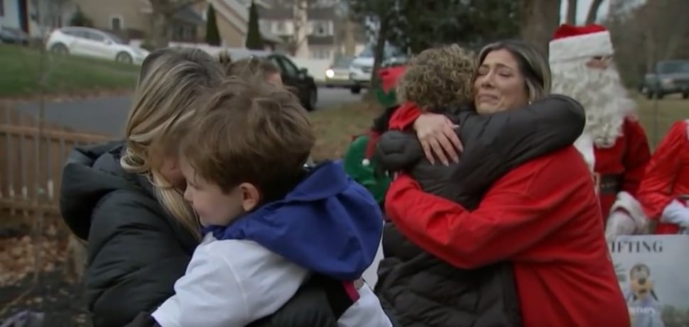 Hugs of joy and gratefulness from the Muss family in Media to the volunteers who shared gifts with them.
