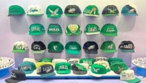 A personal collection of Philadelphia Eagles hats on display at the Philadelphia International Airport.
