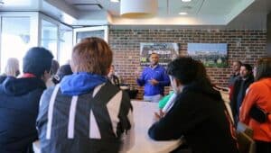 Tracy Jones, part of the adjunct faculty at Widener University's School of Business Administration, talks to high school students at Subaru Park.
