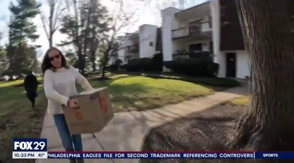A volunteer delivers a holiday care package to a family in need.