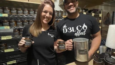 Renee and Leon Beverly of Morton, owners of The D3lco Effect, with a few of their soy candles.