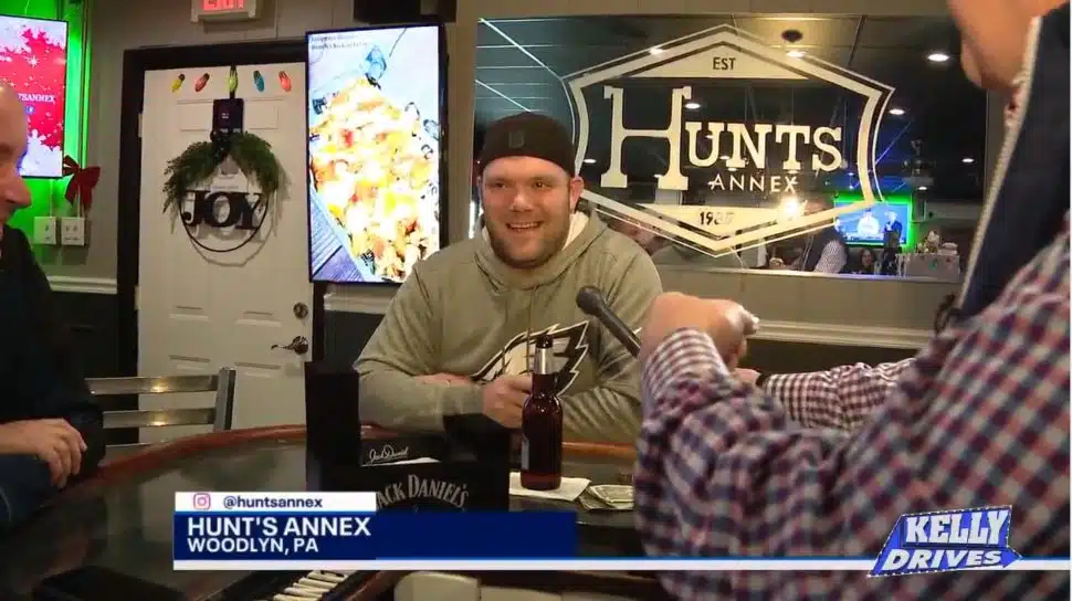 A customer enjoys the atmosphere and the chicken wings at Hunt's Annex in Woodlyn.