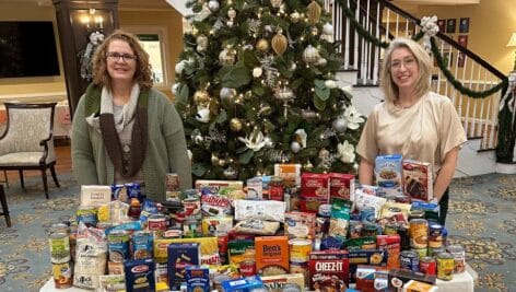 Shown are some of the donated items with Kim Ranck, Director of Community Life Services (left), and Shana Kelly, Community Life Services Coordinator (right).