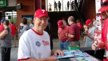 Billionaire Jeff Yass, co-founder of Susquehanna International Group in Bala Cynwyd, seen here buying a program at a Phillies game, donated $6 million to Texas Governor Greg Abbott’s reelection campaign.