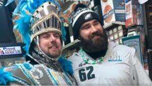 Jason Kelce poses with a fan at Carl's Cards and Collectibles in Havertown during one his visits there.