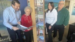 Sharing memories at Tour 'N Travel are (from left) Kevin Moreno, his mother Evelyn Moreno, Tour 'N Travel founder; Debbie Liberatore, Tour 'N Travel current owner and her husband Ron Liberatore.