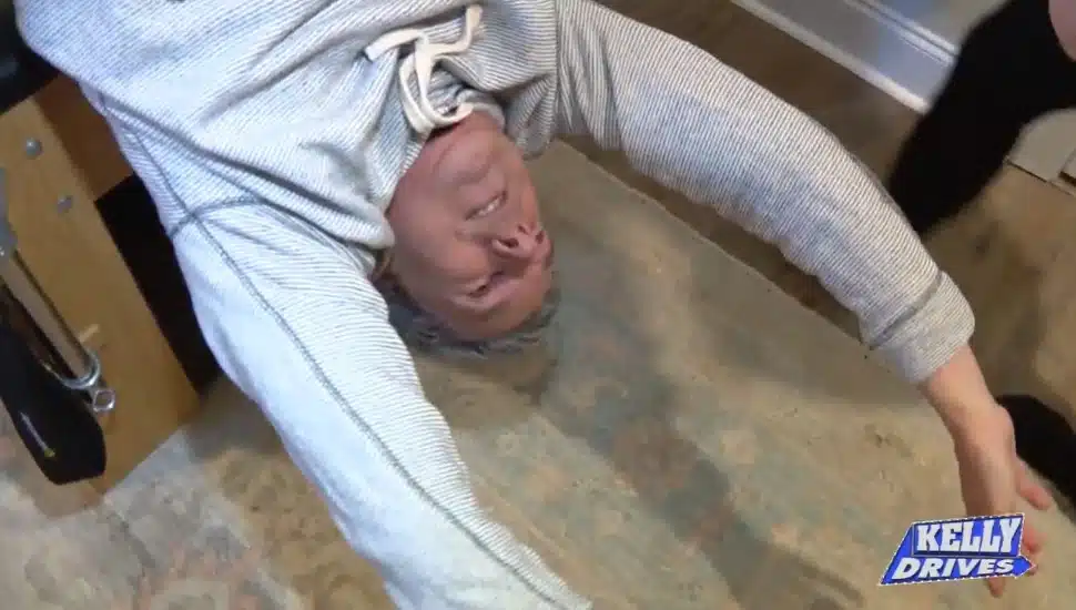 Bob Kelly with Fox 29 is hung upside down, one of the stretching routines at LSF Pilates studio in Wayne.