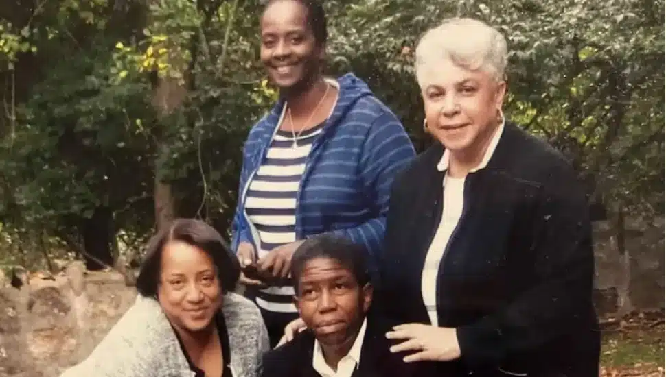 Avis Wanda McClinton (seated in front, in black) attends the headstone placement for the enslaved African people buried in Upper Dublin Friends cemetery.