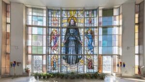 Stained glass window with the image of St. Frances Cabrini.