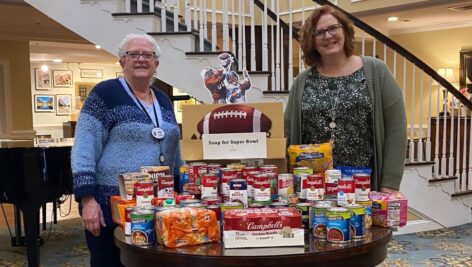 Nancy Brown, Concierge (left) and Kim Ranck, Community Life Services Director (right). Nancy Brown, Concierge (left) and Kim Ranck, Community Life Services Director (right) with donated items for Soup for the Super Bowl', a fundraising event for the Chester Food Bank.