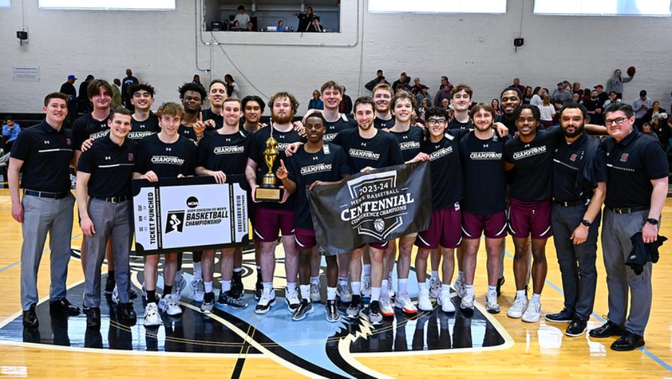 The Swarthmore College men's basketball team celebrates winning the Centennial Conference title.