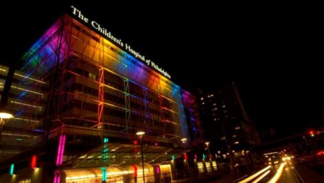 An exterior night time view of Children's Hospital of Philadelphia.