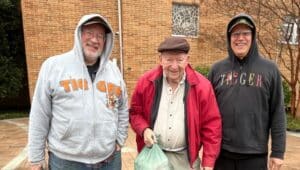 Matt Peck (left) and Bill Peck (center) prepared over 7,000 meals in 2023, helped by Saint John Chrysostom facilities manager Chris Sulpizio (right).