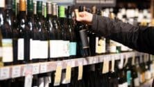 Rows of wine bottles in a liquor store.