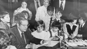 Pennsylvania Gov. Milton Shapp signs legislation on April 10, 1974 naming the firefly as the state insect with Highland Park students on hand