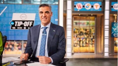 Jay Wright at the basketball analyst desk.
