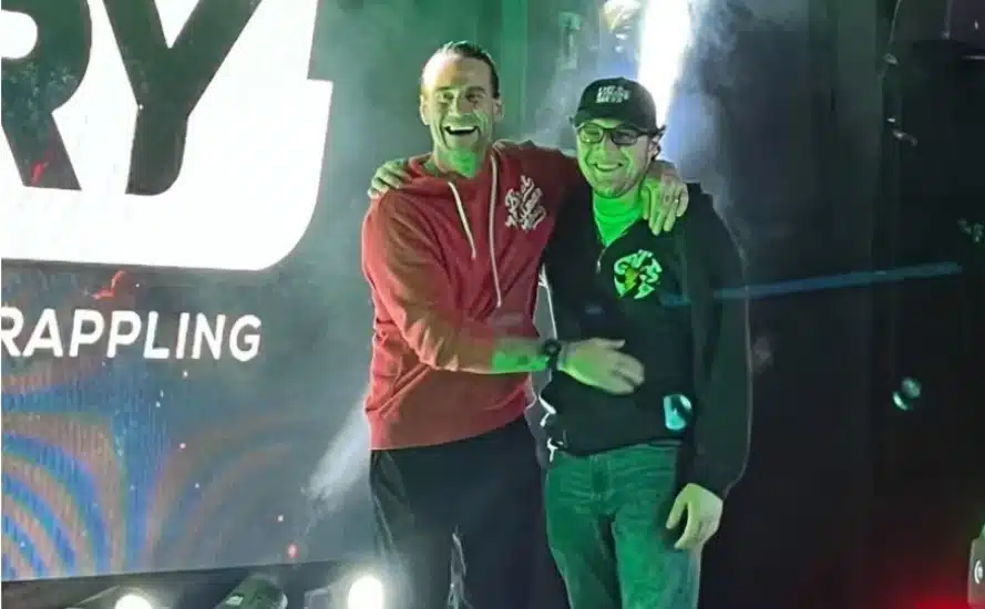 Pro wrestler Luke DiSangro with wrestler and actor CM Punk in December of 2022